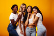 © iordani - diverse multi nation girls group, teenage friends company cheerful having fun, happy smiling, cute posing on yellow background, lifestyle people concept, african-american, asian and caucasian