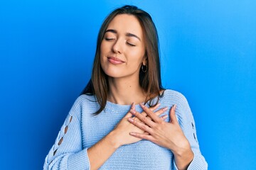 Poster - Young hispanic girl wearing casual clothes smiling with hands on chest with closed eyes and grateful gesture on face. health concept.