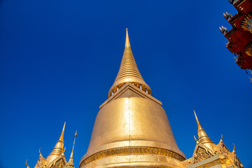 Bangkok, Thailand. View of Phra Si Rattana Chedi - Gold stupa near Temple of Emerald Buddha. Grand Palace.