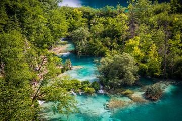 Wall Mural - Plitvice Lakes National Park colorful landscape with turquoise blue and green water in Croatia.