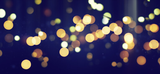 Wall Mural - bright defocused lights over dark background