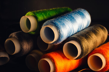 Canvas Print - A selective focus shot of colorful rope rolls for sewing