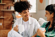 © (JLco) Julia Amaral - Female couple having coffee at home