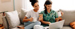 © (JLco) Julia Amaral - Married lesbian couple enjoying an online sale