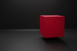 © yalcinsonat - Red cube on black color background stage for product promotion. Minimalist design, modern platform