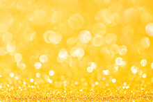Sparkles Of Yellow Glitter Abstract Background. Copy Space