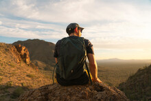 Male Hiker Enjoying A Golden Sunrise And Sunset With The Cactuses In Tucson Arizona In Saguaro National Park