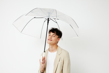 Man transparent umbrella a man in a light jacket Lifestyle unaltered