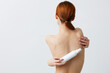 © SHOTPRIME STUDIO - portrait woman skin care lotion with bare shoulders isolated background
