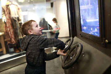 Kid playing racing simulator game