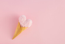 Ice Cream Cone With Heart Against Pink Background. Minimal Love Or Valentine's Day Concept. Flat Lay.