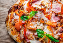 Flatbread Pepperoni Roman Pizza With Mozzarella Cheese, Chicken, Ham, Tomato Sauce, Pepper, Spices. Italian Pizza On Wooden Background