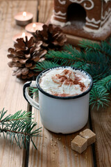 Canvas Print - Hot chocolate in vintage mug on wooden table.