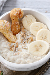 Sticker - Porridge with bananas in a bowl.