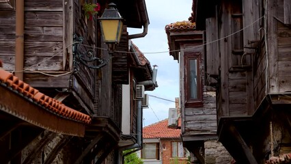 Poster - Wooden houses on old town of Nesebar historic city on Black Sea shore in Bulgaria, 4k video