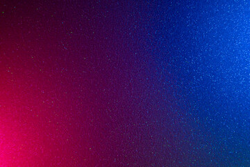 Neon color background. Glitter texture. Holographic radiance. Solar blast. Blur magenta pink blue shimmering grain texture dark color gradient abstract overlay.