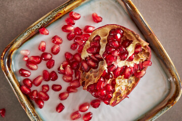 Wall Mural - pomegranate seeds in a  plate