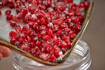 Wall Mural - Mixed sugar and pomegranate on a plate