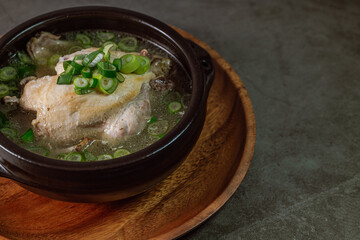 Samgyetang, Korean Ginseng Chicken Soup : Tender, whole, young chicken stuffed with ginseng, jujubes, sweet rice, and whole garlic cloves and simmered until tender. The combination of chicken and gins