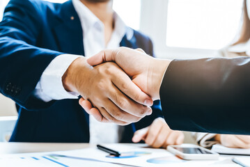 group of successful business people meeting. client and suppliers shaking hands after deal agreement