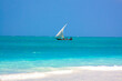 Traditional african sailboat in azure water of Indian ocean. Zanzibar, Tanzania