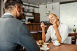 © Dusan Petkovic - A couple eating cake at restaurant.
