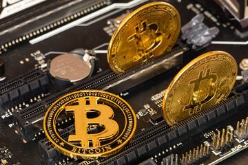 Bitcoin on computer motherboard background