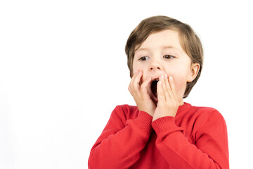 Amazed surprised little boy stand white background