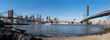 Sunny New York City Manhattan Downtown panoramic Cityscape with the  Brooklyn Bridge, the Manhattan Bridge and a boat the Hudson River, us