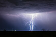 Real lightning. Two cloud to ground lightning bolts strike inside a thunderstorm in New Mexico