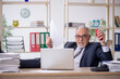 © Elnur - Old male employee and too much work in the office