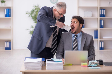 Two male bookkeepers in budget planning concept in the office