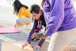 © Sangiao_Photography - group of multicultural women prepare banner for 8 march break the bias womens international day