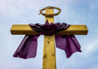 Wood cross with purple cloth and crown of thorns during lent before Easter