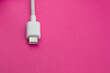 © Mateus - USB cable type C over red background