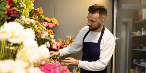 flower shop manager on the background of bouquets