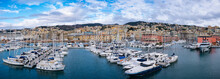 Italy, Liguria, Genoa, Panoramic View Of Boats Moored In City Harbor