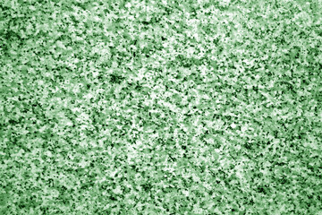 Wall Mural - Granite surface as background with blur effect in green tone.