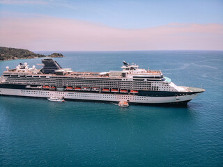 Big white cruise liner, beautiful seascape, horizon and sky, recreation concept.