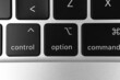 © FellowNeko - Option key and button on keyboard. Option sign close-up. Modern laptop, communication concept photo