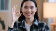 Female portrait happy recommending smiling winner asian woman girl showing ok gesture everything fine sign success good news done consent victory symbol folding fingers zero looking at camera at home