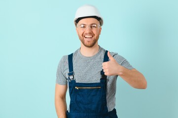 Wall Mural - Close-up portrait of his he nice attractive cheerful cheery content guy repairer craftsman isolated over blue color background.