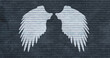 Mural or graffiti art. White angel wings on old brick wall in a shade of graphite. Perfect background for photo studio or wallpaper for an industrial loft. 