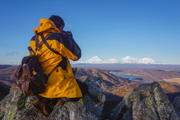 The guy takes pictures of volcanoes in Kamchatka