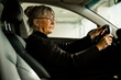 © Johnér - Senior woman in car