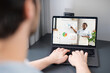 © Vadim Pastuh - Male student using app for distance video communication with female colleague, teacher, tutor, man talking with coach boss online, staying connected in pandemic, african woman leading virtual meeting