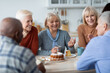 Healthy and active senior people drinking tea together