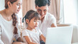 © tuastockphoto - happy family surfing internet together at lovely home