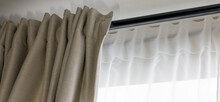Double Layer Day And Night Curtains On Black Rod In Living Room