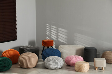 Canvas Print - Many stylish different poufs in room. Home design